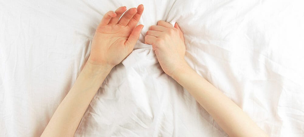 sex positive therapy - arms on bed